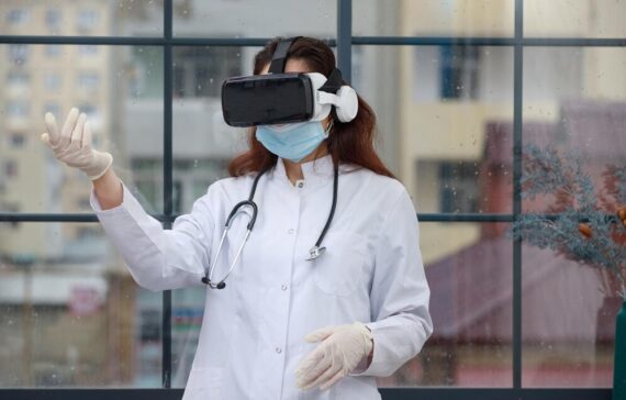 young-female-doctor-wearing-vr-glasses-holding-her-hand-up-high-quality-photo_144627-75383